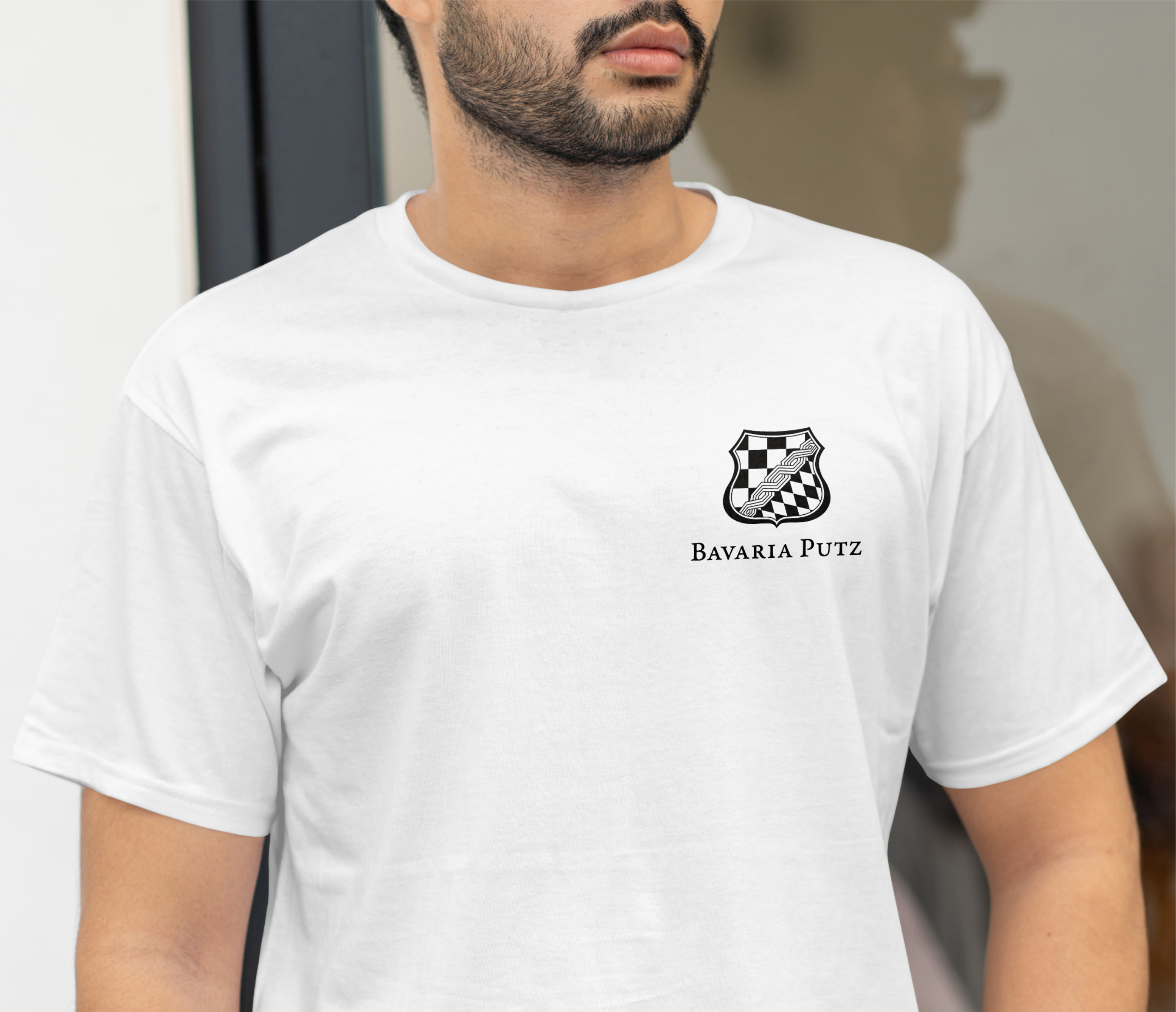 Man with a white tshirt with logo bavaria putz